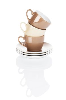 brown and fawn stapled coffee cups on white background with reflection