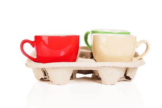 coffee cups in cupholder on white background