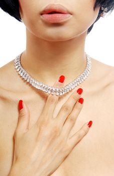 Closep photo of the woman with brilliant necklace on her neck and hand