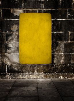 Yellow grunge background over a old stone wall