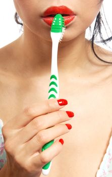 Close-up photo of the woman with toothbrush in her hand