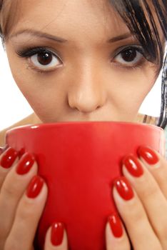 Close-up photo of the woman drinking or eating from the red cap