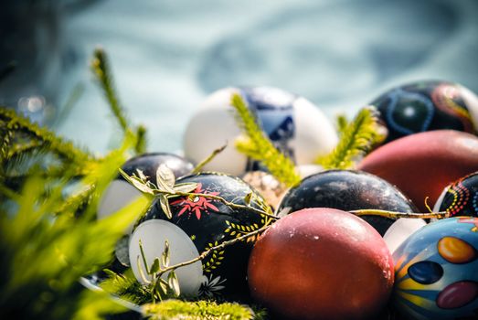 Vintage Eastern European Easter Eggs  in a plate. White eggs with floral patterns.