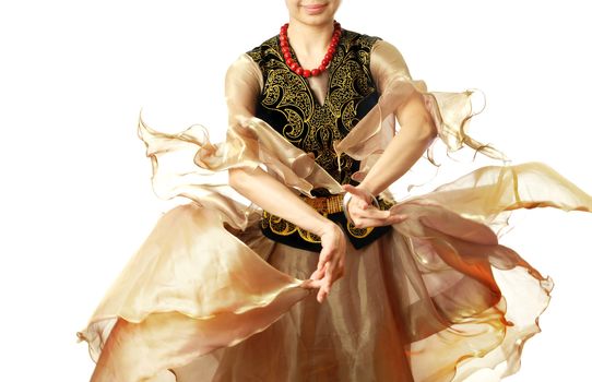 Lady in traditional oriental costume acting Uzbek dance