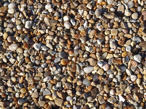 assorted colorful and smooth pebbles from the beach