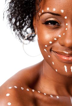 Half face of Happy smiling beautiful indigenous African tribal woman with white dots and lines makeup, isolated.