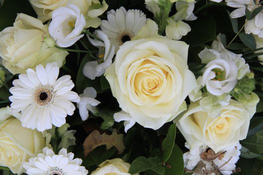 mixed white floral arrangement with roses, freesia and gerbera
