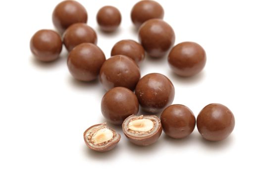chocolate balls with nuts on a white background
