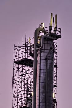 Industrial tower in early morning light.