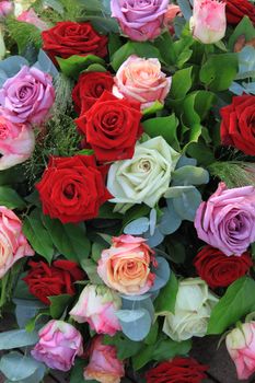 Floral arrangement with roses in different bright colors