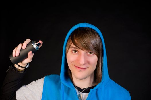 Smiling teen and his graffiti spray can