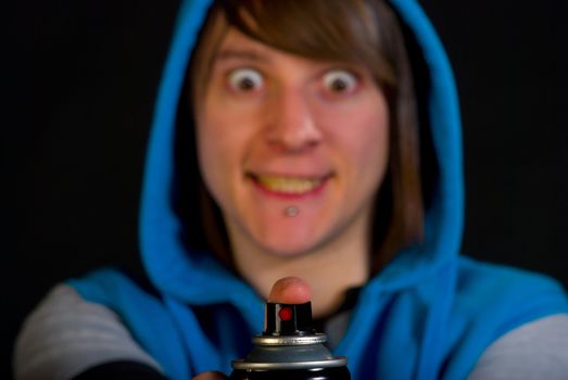 Graffiti artist freaking out with a can in his hands