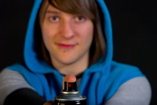 Closeup of a graffiti artist ready for action