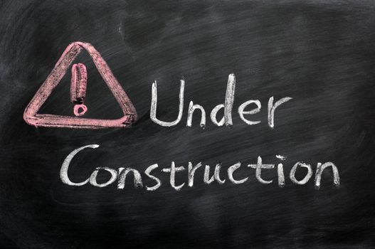 Page under construction concept drawn in chalk on a blackboard