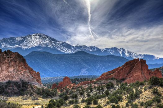 A High Dynamic Range photo of the Garden of the Gods park in Colorado Springs, Colorado with Pikes peak in the background.