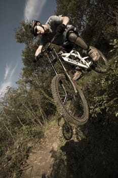 Downhill extreme biker jumping.

Shot on hill Pomjan, 28.9.2007.