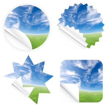 Illustrations of beautiful stickers with green grass and blue sky. Blank and isolated.
