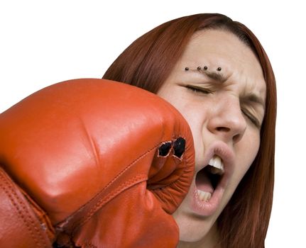 Redhead girl punched in the face with a boxe glove