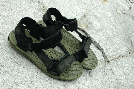 A pair of sandals on the rock