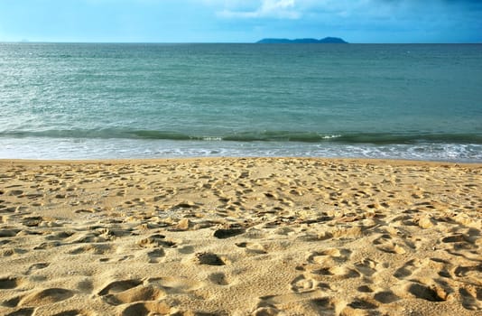 Peaceful sandy tropical beach on a summer day