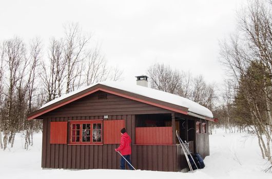 A winter cabin on a snowy landscape