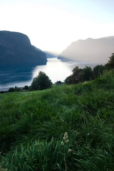 Fjord in western Norway as the sun goes down - great copyspace in the bottom area, or sky.