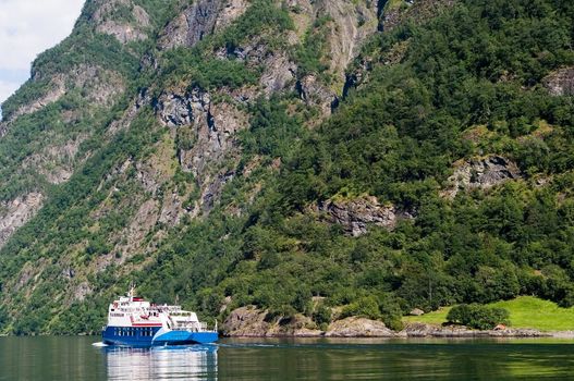 Cruise ship on Sognefjord near Gudvangen in the western area of Norway.
