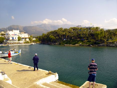anglers at the harbour of sissi, crete