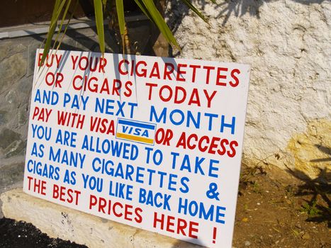 sign offering credit card pay for cigarettes and cigars in greece