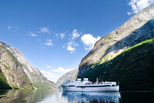 Large cruise ship on Sognefjord near Gudvangen in the western area of Norway.