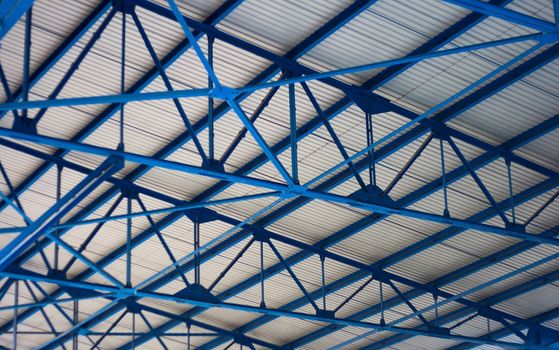 white-blue geometric construction ceiling of stadium tribune