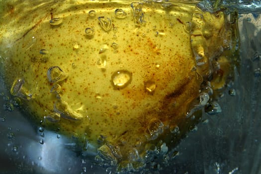 The image of a pear in water