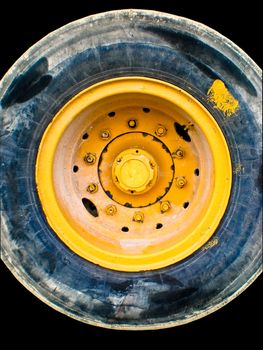 Stained truck tire on a black background