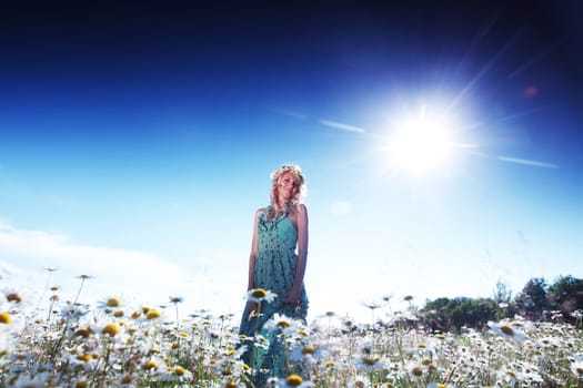  beautiful girl  in dress on the sunny daisy flowers field 