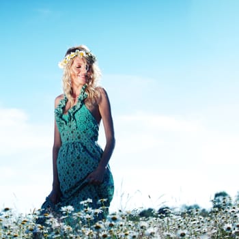 beautiful girl  in dress on the daisy flowers field 