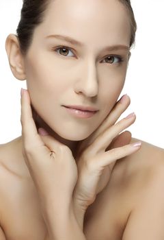 Beautiful Young Woman touching her Face. Skincare .Perfect Skin. Spa isolated on a white background