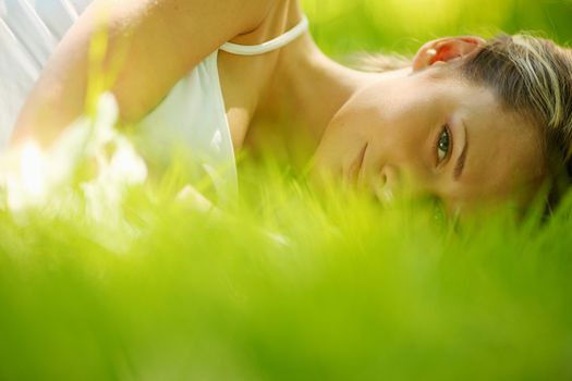 woman sleep on green grass