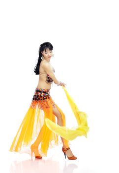 Dancer in the orange costume playing with yellow cloth