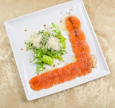Fish Carpaccio with salad and mozzarella