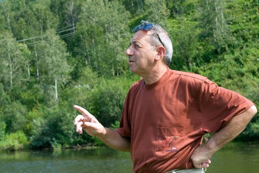 Portrait of the man on a background of the nature