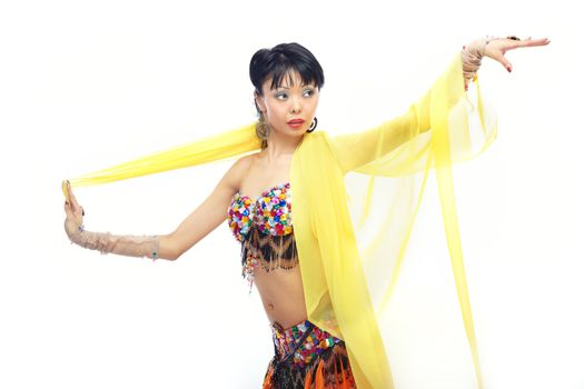 Asian lady dancing belly-dance with yellow fabric