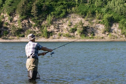 Fishing on the mountain river with fast current