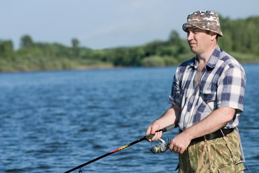 Fishing on the mountain river with fast current