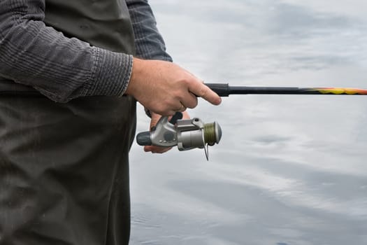 Fishing on the mountain river with fast current