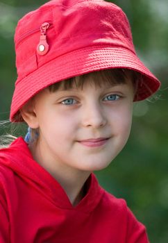 The girl in a red hat with blue eyes