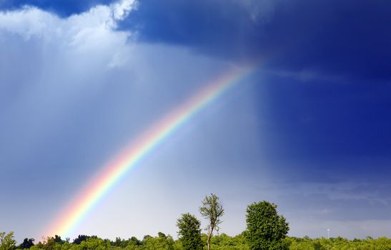 A rainbow forms as a storm passes through