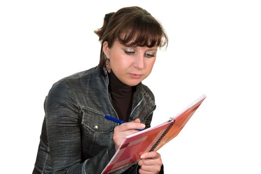 The girl on a white background does records in a notebook