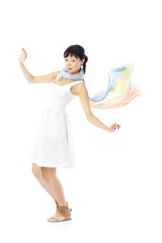 Brunette lady in white dress and colorful scarf dancing on a white background