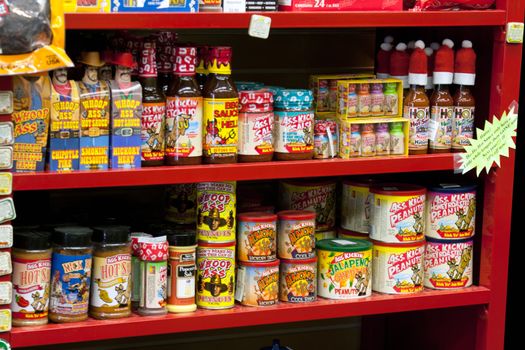 Assortment of hot sauce on store shelf