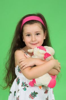 Portrait of the girl on a green background